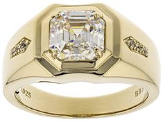 3.25ct octagonal asscher cut lab created Fabulite Strontium Titanate and .04ctw round white zircon 18k yellow gold over sterling silver mens ring. Measures approximately .31" L x .06" W. Not sizeable. Classic Octagon Diamond White Jewelry, Modern Jewelry With Asscher Cut And Polished Finish, Classic Octagon Cubic Zirconia Ring, Classic Cubic Zirconia Octagon Ring, Classic Cubic Zirconia Ring Octagon Shape, Classic Octagon Ring With Diamond Accents, Gold Cubic Zirconia Jewelry With Asscher Cut, Classic Octagon Jewelry For Anniversary, Octagon Diamond Jewelry With Polished Finish