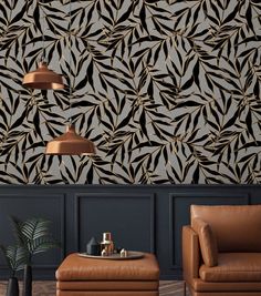 a living room with two leather chairs and a coffee table in front of a patterned wall