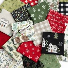 a pile of christmas fabric on top of each other