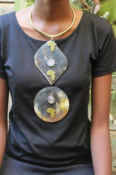 Handmade in Nairobi , Kenya! Crafted with horn pendants brass pendants and finished with a brass neckpiece. SHIPPING Shipping is done via DHL Express, 3-7 days delivery, Add multiple items to your cart and pay shipping for one item ONLY! Metal Beaded Necklace With Large Beads, Metal Necklace With Large Beads For Gift, Unique Long Beaded Necklace, Large Beads Pendant Necklace Gift, Handmade Metal Pendant Long Necklace, Large Beads Pendant Necklace For Gift, Large Beaded Pendant Necklace As Gift, Pendant Necklace With Large Beads For Gifts, Unique Pendant Beaded Necklace