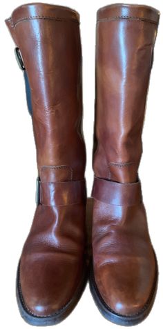 Western Style Brown Moto Boots With Leather Lining, Western Brown Moto Boots With Leather Lining, Brown Moto Boots With Leather Lining For Ranch, Brown Round Toe Riding Boots, Brown Leather Boots With Wide Calf Fit, Brown Snip Toe Moto Boots For Riding, Brown Wide Calf Boots With Leather Lining, Brown Leather Moto Boots For Ranch, Leather Boots With Wide Calf And Buckle Closure