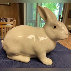 a ceramic rabbit sitting on top of a table