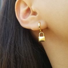 "Get a lock on style with these edgy-eclectic statement earrings cast in 16k gold plated. ♥ 18K Gold Plated On The Top of 925 Sterling Silver ♥ Measurement of Padlock Pendant: 11 mm Tall and 7.5 mm Width ♥ Diameter of Latch Back Hoops: Outer - 12 mm / Inner - 8 mm ♥ Nickel Free ♥ Sold as Single (ONE earring) or A Pair ♥ All items are packed inside an elegant Gold Spoon jewelry box. If you are purchasing a product to send as a gift, we can send the product directly to the recipient. Please ensure Pierced Huggie Plug Earrings As A Gift, Gift Drop Huggie Earrings, Huggie Plug Earrings For Gifts, Everyday Dangle Earrings For Pierced Ears, Earrings Edgy, Gold Spoon, Edgy Earrings, Dangle Earrings Gold, Earrings Everyday