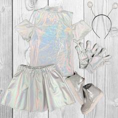 Includes top, skirt, headband and gloves. Complete the look with our matching silver sneaker booties! Kids Alien Costume, Girl Alien Costume, Kid Halloween, Alien Costume, Silver Holographic, Clothing Manufacturer, Girls Toddler, Halloween Costumes For Kids, Costume Dress