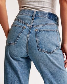 Elevate your denim collection with the Abercrombie & Fitch Women's High Rise Loose Jean, a nod to early 2000s fashion with a modern twist. These jeans feature a medium wash known as Medium Thigh Destroy, characterized by thigh slash details and a distressed hem that adds a touch of edginess to your look.

- Size: 30
- Color: Medium Thigh Destroy
- Material: Body - Cotton, Lyocell; Pocket Bag - Cotton blend
- Gender: Female
- Fit: High rise (10.5”), relaxed at the waist and hips, loose full-lengt High Rise Loose Jeans, Female Features, Early 2000s Fashion, Women's Bottoms, Denim Pocket, Denim Collection, Loose Jeans, Denim Cotton, Pocket Bag