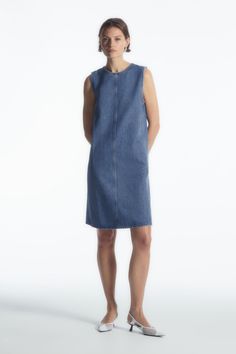 PANELED DENIM SHIFT DRESS - BLUE - Dresses - COS Relaxed Fit Mini Denim Dress For Work, Relaxed Fit Knee-length Mini Dress For Work, Relaxed Fit Cotton Denim Mini Dress, Indigo Relaxed Fit Knee-length Denim Dress, Cotton Denim Mini Dress With Relaxed Fit, Indigo Knee-length Relaxed Fit Denim Dress, Relaxed Fit Mini Denim Dress, Indigo Knee-length Denim Dress With Relaxed Fit, Knee-length Medium Wash Mini Dress For Work