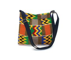 This bag is made with 100% cotton African fabric, a fusible interface, and is lined. It is a unique bag, perfect to wear as a crossbody or shoulder bag. It is a great gift for anyone. Measurements: 9.5 inches wide x 9 inches height x 2 inches deep. - Zip Closure - The strap hangs at 21 inches long (not adjustable) - 1 slip pocket inside. This bag is handmade by me in a pet-free and smoke home. All tension areas like the strap are double stitched for a stronghold. Please visit my shop at: http:// Multicolor Canvas Shoulder Bag With Zipper Closure, Multicolor Cotton Bag With Zipper Closure, Multicolor Fabric Bags With Zipper Closure, Multicolor Shoulder Bag With Adjustable Strap As Gift, Multicolor Fabric Shoulder Bag With Adjustable Strap, Multicolor Cotton Shoulder Bag With Zipper Pocket, Casual Multicolor Fabric Shoulder Bag, Reversible Multicolor Fabric Shoulder Bag, Trendy Multicolor Fabric Shoulder Bag