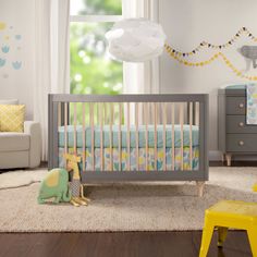 a baby's room is decorated in pastel colors