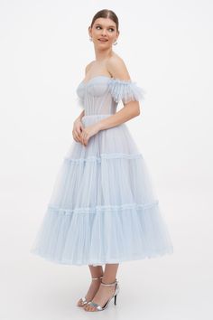 Buy Light Blue Ruffled Tulle Midi Dress at Milla Dresses. Wide size range from XXS to XXL. FREE shipping across the USA. Return in 30 days. Blue Tulle Dress With Lined Bodice, Formal Corset Dress With Sweetheart Neckline And Ruffles, Blue Tulle Dresses With Corset Back, Evening Organza Corset Dress With Ruffles, Cocktail Evening Dress With Lined Bodice And Tulle, Cocktail Evening Dress With Lined Bodice In Tulle, Blue Tulle Dress With Boned Bodice, Elegant Blue Tulle Corset Dress, Ruffled Corset Dress For Gala And Prom Season