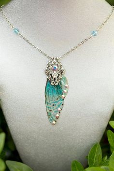 FREE SHIPPING ON ALL ORDERS OVER $35 IN THE US!!!The Selkie Fairy Wing necklace is made with our Cyan speckled ombre' mini fairy wings and accented with Swarovski rhinestones and a filigree silver stamping. Wings 2" LongThis necklace is so stunning in person, we combined our love art nouveau and fairy magic to create this unique necklace.No Fairies were harmed in the making of this jewelry. The wings are harvested during the fall molt.We ship rush and internationally.Send us a message to inquire Fest Ideas, Ren Fest, Fairy Jewelry, Fairy Necklace, Magical Jewelry, Fairy Magic, Wing Necklace, Fairy Wings, Unique Necklace