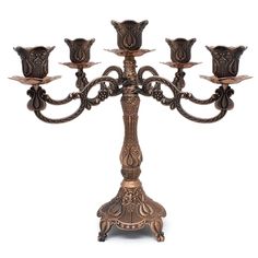 an ornately decorated candelabra with five candles on each candle holder,