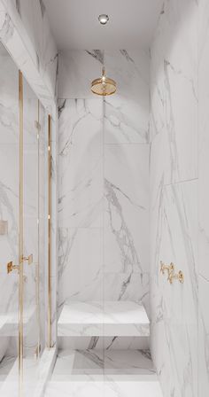 a white marble bathroom with gold accents