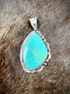 .925 sterling silver large turquoise pendant. Collectible Turquoise Sterling Silver Necklace, Turquoise Teardrop Pendant With Large Stone, Untreated Turquoise Pendant Jewelry, Turquoise Teardrop Pendant Jewelry With Large Stone, Elegant Turquoise Jewelry With Large Pendant, Elegant Oval Turquoise Necklace With Large Pendant, Turquoise Large Pendant Jewelry, Southwestern Sterling Silver Turquoise Necklace With Large Stone, Turquoise Teardrop Pendant Large Jewelry