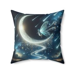 a decorative pillow with a fairy sitting on the crescent and stars in the night sky