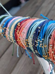 P U R A V I D A B R A C E L E T these pura vida inspired bracelets are made so that you can have a similar bracelet for cheaper! these are durable, so you do not have to worry about the string breaking. these bracelets are waterproof, so you can wear them in the water and are also adjustable, so you do not have to worry about the fit. these bracelets are made extra-long, so that one size can fit all. however, if the ends are too long for your taste, you can simply cut, tie, and burn the ends. ea Adjustable Gold Beads Friendship Bracelets, Multicolor Friendship Bracelets With Gold Beads For Beach, Multicolor Gold Beads Friendship Bracelet For Beach, Adjustable Colorful Beaded Bracelet, Adjustable Beaded Colorful Bracelets, Colorful Adjustable Beaded Bracelet, Adjustable Silver Beads Bracelets For Summer, Adjustable Casual Friendship Bracelets With Gold Beads, Adjustable Gold Beads Friendship Bracelet For Beach