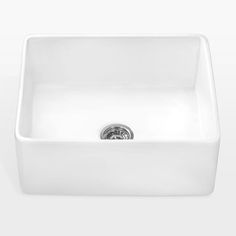 a white sink sitting on top of a counter