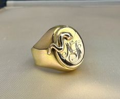 1950s Vintage Italian Signet Ring, US Size 7 3/4, 18k solid gold, with a beautiful 3D snake and initials 'NF', in good vintage condition. Hallmarked 750 for 18k gold, makers mark '615' and 'VI' for Venice. Material: 18k gold (750 gold) Total weight: 7.4 g US Size: approx. 7 3/4 (EU size 56) Box on the photos not included. PLEASE LOOK AT THE PICTURES, THEY ARE PART OF THE DESCRIPTION AND ARE THE ACTUAL ITEM YOU WILL RECEIVE. Collectible Yellow Gold Signet Ring With Initials, Antique Hallmarked Snake Ring, Classic Gold Snake Ring For Formal Occasions, Heirloom 14k Gold Snake Ring For Formal Occasions, Antique 14k Gold Snake Ring For Anniversary, Classic Yellow Gold Snake Ring For Anniversary, Antique Gold Snake Ring For Formal Occasions, Vintage 14k Yellow Gold Snake Ring, 14k Gold Hallmarked Snake Ring For Anniversary