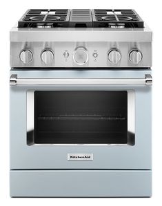 a black and silver stove with four burners on it's side, in front of a white background