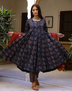 This is a an easy & breezy perfect-for-spring 3 piece suit set. It comes with a 3/4th sleeves bagru print kurta with 32 kali & matching border on the hem and sequence detailing on the neck teamed with printed pants with semi elasticated waistband and a mulmul dupatta with gota work and tassels on the edges. 3 piece set Color- Blue & Red Work-Bagru Print on suit set and embroidery, zari & tassels detailing on dupatta Set Fabric-Cotton Dupatta Fabric-Mulmul Sleeves-3/4th Sleeves Neck-Round Neck Le Ankle-length Fitted Kurta With Printed Motifs, Fitted Ankle-length Kurta With Printed Motifs, Fitted Anarkali Set With Kalamkari Print For Eid, Fitted Kalamkari Print Churidar For Navratri, Fitted Ankle-length Salwar Kameez With Printed Motifs, Fitted Kalamkari Print Salwar Kameez For Transitional Season, Anarkali Blue Lawn Suit With Block Print, Blue Anarkali Lawn Suit With Block Print, Transitional Fitted Salwar Kameez With Kalamkari Print