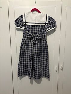 vintage stmichael from marks & spencer's nautical style dress navy & white  sailor collar age 5 years height 43" chest 22" material: 55% cotton, 45% polyester  ties at the back lovely style buttons with a spare button to inside label Spring School Dress With Peter Pan Collar, Collared Spring Dresses For School, Spring School Dress With Collar, Spring Sailor-style Short Sleeve Dresses, Sailor Style Short Sleeve Fitted Dress, Fitted Sailor Dress With Short Sleeves, Blue Fitted Dress With Sailor Collar, Fitted Short Sleeve School Uniform Dresses, Preppy Fitted Collared Dress