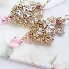 Chandelier statement wedding earrings. Hand embroidered with rhinestone on Venice lace, topped with lovely crystals. Earrings are very light and comfortable to wear, you can order matching bracelet and hair pins (separately). You can as well order earrings in other rhinestone crystals. This earrings will be shipped nicely packed in the gift box. For other wedding jewelry visit my shop; https://www.etsy.com/shop/byPiLLowDesign Elegant Pink Sparkling Crystal Earrings, Statement Wedding Earrings, Order Earrings, Boho Wedding Earrings, Wedding Earrings Chandelier, Pink Crystal Earrings, Statement Earrings Wedding, Bridal Earrings Chandelier, Crystals Earrings