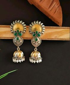 You'll find these Sunflower design jhumka pieces decorated with colorful stones, beads adding even more charm to their rustic beauty. Whether it's a pair of Stud kundan earrings, a necklace, or bracelets, each tells a story of craftsmanship and creativity. Stud Earrings For Women, gift for her,  Designer Navratri Earring,  Indian style Handmade Earrings,  Traditional Jewelry * Main Color : Dark Silver Plated * Skin Friendly : This Product does not contain harmful constituents. Anti-allergic safe Handmade Jhumkas For Navratri, Handmade Jhumkas For Rituals And Festivals, Handmade Fusion Style Dangle Jhumkas, Handmade Temple Jewelry Jhumkas Drop Earrings, Handmade Fusion Dangle Jhumkas, Handmade Temple Jewelry Style Jhumkas, Handmade Temple Jewelry Jhumkas, Multicolor Earrings For Diwali Rituals, Fusion Style Jhumkas With Latkans For Gift