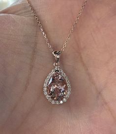 "Beautiful Morganite and Diamond Necklace 14K rose gold pendant. Lays nicely on the neck. Just the perfect size. Genuine pink morganite pear cut 2.80 carats morganite 12x8mm pear morganite Clarity: VS Eye clean stone Genuine earth mined round brilliant cut diamonds 0.38 carats diamonds 18\" 14K Rose Gold necklace Comes with gift box" Luxury Rose Gold Moissanite Necklace, Rose Gold Pear-shaped Gemstone Necklaces, Rose Gold Pear-shaped Gemstone Necklace, Formal Morganite Teardrop Jewelry, Formal Pear-shaped Morganite Jewelry, Fine Jewelry Pear-shaped Rose Gold Necklace, Fine Jewelry Rose Gold Pear-shaped Necklace, Rose Gold Pear-shaped Fine Jewelry Necklace, Pear-shaped Rose Gold Necklace For Formal Occasions