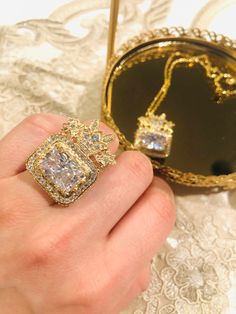 Koohe-nour Dimond of Nader Shah.Golden ring and necklace ,gold plated,Non Allergy and sensitivity    Length 2inch Width. 2inch Anti allergy Adjustable size for golden ring دریای نور درشت ترین و زیباترین الماس برلیان در میان گوهرهای سلطنتی ایران و یکی از گوهرهای معروف جهان است. این الماس در جنگ با هند در سال ۱۷۳۹ میلادی همراه با نادر شاه افشار بودهاست. دریای نور پس از قتل نادر به نوهٔ او شاهرخمیرزا (آخرین پادشاه افشار) رسید و سپس به دست امیر علم خان خزیمه و بعد به محمد حسن خان قاجار و بعد به لطفعلیخان زند و سر انجام به دست آقا محمدخان قاجار افتاد 14k Gold Plated Jewelry For Weddings, 14k Gold Plated Wedding Jewelry, Anniversary Costume Jewelry Plated, Anniversary Costume Jewelry, Plated, Yellow Gold Pendant Jewelry For Party, Gold-plated Jewelry For Gift, Fine Plated Jewelry Gift, Fine Jewelry Gift, Plated, Fine Jewelry Gift Plated