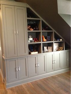 an image of a room with shelves and cupboards in the corner on top of it