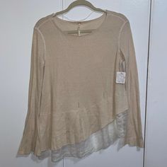 Free People Brand New Sweater/Tunic With Asymmetrical Lace Trim And And Bell Sleeves Distressed Fabric Nwt Brand New Never Worn Ivory/Cream Color Size M Casual Spring Sweater With Asymmetrical Hem, Casual Sweater With Asymmetrical Hem For Spring, Beige Tops With Shirttail Hem For Spring, Beige Shirttail Hem Top For Spring, Cream Crew Neck Blouse For Fall, Cream Knit Top For Spring Layering, Neutral Long Sleeve Knit Top For Spring, Spring Neutral Long Sleeve Knit Top, Beige Crew Neck Blouse For Layering