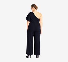 Modern elegance has arrived in this stunning new silhouette. This jumpsuit features a structured design, one shoulder silhouette with flutter sleeve, and long wide leg pants. Paired with sparkling peep toe heels, this beautiful jumpsuit is a striking look. AP1E201788 Imported Dry Clean Main Fabric Content:95% Polyester, 5% Elastane Lining Content:100% Polyester Comfortable and effortless, with lots of stretch. 33.00" Inseam Due to variances in computer monitors and mobile screen settings as well Beautiful Jumpsuits, Chiffon Shawl, Black Plus Size, One Shoulder Jumpsuit, Review Dresses, Peep Toe Heels, Black Fits, Modern Elegance, Flutter Sleeve