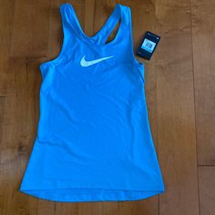 Nwt Nike Pro Dri Fit Tank Top Size Medium Blue White Swoosh Functional Blue Racerback Tops, Functional Blue Sports Tops, Nike Breathable Blue Activewear, Blue Go-dry Racerback Top, Blue Racerback Top With Go-dry Technology, Sporty Light Blue Training Tops, Blue Moisture-wicking Racerback Top, Blue Racerback Sports Top, Blue Racerback Top For Sports