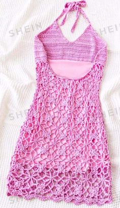 a pink tank top is laying on a white sheet with the words, free crochet pattern