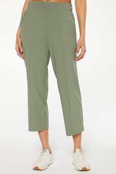 With a high stretch content for maximum mobility, these cropped, relaxed-fit pants feature a comfort waistband with an elasticized back and convenient side pockets for your phone, cards, and keys. Brand: Marika 76% Nylon / 24% Spandex 12" Front Rise / 15¾” Back Rise 25" Inseam (Size M) 2" Encased Elastic Waistband Relaxed Fit Front Seam Pockets Machine Wash Color: Agave Green Green 4-way Stretch Elastane Pants, Wide Leg Activewear With Pockets And 4-way Stretch, Workwear Bottoms With Elastic Waistband And 4-way Stretch, 4-way Stretch Activewear With Pockets Ankle-length, Business Casual Cropped Pants With Elastic Waistband, Versatile Workwear Bottoms With Comfort Waistband, Spring Activewear With 4-way Stretch And Side Pockets, Athleisure Ankle-length Pull-on Pants, Solid Ankle-length 4-way Stretch Bottoms