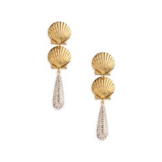 Adorned with a touch of glamour, these earrings feature rhinestone tassels gracefully dangling from golden shells, creating a striking and dynamic accessory. Elegant Shell Jewelry For Parties, Elegant Gold Shell Earrings, Elegant Gold Dangle Shell, Elegant Gold Dangle Shell Earrings, Luxury Gold Shell Earrings, Gold Shell-shaped Earrings For Party, Elegant Shell-shaped Earrings, Elegant Shell-shaped Metal Earrings, Luxury Statement Shell-shaped Earrings