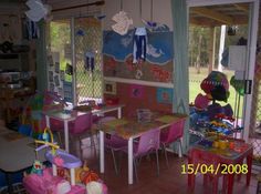 a child's playroom with tables and chairs