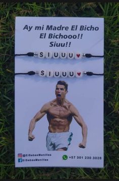 an advertisement on the grass with a man wearing a string bracelet in front of him