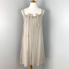 Excellent Pre-Owned Condition! Beige Pleated Sleeveless Dress For Summer, Spring Silk Dress With Tie Straps, Spring Silk Dresses With Tie Straps, Silk Dresses With Tie Straps For Spring, Sleeveless Linen Dress With Ruffles, Beige Pleated Sleeveless Mini Dress, Beige Sleeveless Pleated Mini Dress, Beige A-line Sleeveless Dress For Daywear, Sleeveless Silk Mini Dress For Daywear