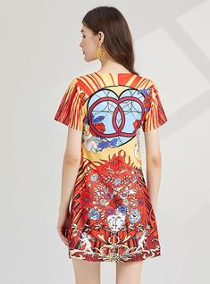 Carnival of Hue: This vibrant, stained glass-inspired dress is a wearable piece of art, flaunting a bold palette of red, yellow, and blue, intermingled with striking patterns that catch the eye. The short-sleeve design, coupled with the A-line silhouette, offers a casual yet flattering fit that moves with grace and ease. It's a piece that celebrates color and creativity, making it a perfect choice for those who love to stand out in a crowd. The kaleidoscopic patterns are not just visually compel Multicolor Graphic Print Short Sleeve Dress, Short Sleeve Multicolor Graphic Print Dress, Multicolor Bold Print Short Sleeve Dress, Fitted Multicolor Print Dress With Short Sleeves, Short Sleeve Bold Multicolor Print Dress, Red Abstract Print Summer Dress, Multicolor Short Sleeve Mini Dress With Vibrant Print, Casual Mini Dress With Vibrant Print And Short Sleeves, Colorful Pattern Short Sleeve Summer Dresses