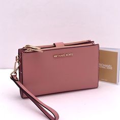 Brand New With Tag Color: Primrose Gold Tone Hardware Saffiano Leather Michael Kors Doublezip Wallet Wristlet Phone Case 6 Credit Card Holders 1|D Holder 2 Slip Compartments 2 Zip Pockets A Phone Holder Slot And A Large Bill Section Accessible From The Side 7.25" 4.25" 1" Comes With A Detachable Wrist Strap This Is An Outlet Style Chic Pink Wallet With Zipper Closure, Blush Bag With Card Slots, Pink Everyday Clutch With Zipper Closure, Pink Clutch With Zipper Closure, Michael Kors Pink Wallet With Zipper Closure, Michael Kors Pink Wallet For Daily Use, Michael Kors Clutch With Zipper Closure, Elegant Pink Wallet With Zipper Pouch, Pink Evening Clutch With Card Slots