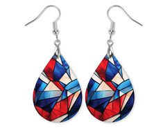 Red, White, and Blue Stained Glass Dangle Earrings   These beautiful Red, White, and Blue Stained Glass dangle statement earrings are made with MDF wood and printed on both sides. We do not use any vinyl or stickers. The material is engineered with a special glossy surface that accepts the image with vibrant colors.  Each pair is handmade and packaged in our studio in Illinois! The teardrop earrings 1.5" long and 1" wide for the actual teardrop and 1/8" thick. They hang about 2.25" long from the Patriotic Multicolor Dangle Jewelry, Patriotic Blue Drop Earrings, Blue Patriotic Drop Earrings, Patriotic Red Drop Earrings, Patriotic Multicolor Earrings As Gift, Patriotic Blue Earrings For Gift, Fourth Of July Earrings, 4th Of July Jewelry, Stained Glass Earrings