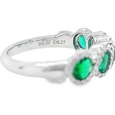 18 Karat White Gold Ring Featuring 5 Oval Emeralds Totaling 0.99 Carats Accented by 74 Round Diamonds of VS Clarity and G Color Totaling 0.25 Carats. Finger Size 6.5. Jae's Jewelers includes one ring sizing service on most ring purchases; please indicate desired size in checkout notes. Oval Emerald Ring With Prong Setting In Platinum, Oval Platinum Emerald Ring With Prong Setting, Silver Oval Diamond Ring With Half Eternity Band, Oval Silver Diamond Half Eternity Ring, Formal Stackable Oval Rings With Prong Setting, Formal Oval Stackable Rings With Prong Setting, Oval White Gold Diamond Ring With Half Eternity, Oval Half Eternity Diamond Ring In Fine Jewelry Style, Oval Half Eternity Ring For Formal Occasions