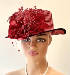 The hat featured here is a small brimmed red  straw hat with a black trim. On the side of the hat is a large and plush  red flower made from a grouping of red satin petals. On top of these petals is a draped red appliqué. Sewn onto this ted fabric are red sequins and red balls. Several strands of clear thread with red beads hang down past the brim of the hat. This  one of a kind  hat was made by Letty in New York. Creating the look that suits you best can be achieved just by  turning the hat on your head creating a different look with each twist till you find the look you love.. This classic hat is a beautiful Church hat or a Kentucky Derby Hat.  Also perfect  for  an Easter Hat, Tea Party hat, Wedding Party Hat, Fancy Dress Hat, a gothic hat, hobo hat, and other special occasions hat. Bri Special Occasion Hats, Hat Tea Party, Red Drapes, Easter Hat, Easter Hats, Hat Wedding, Church Hat, Tea Party Hats, Wedding Hat