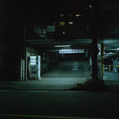 an empty parking garage at night time