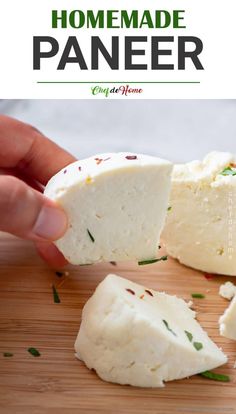 someone is cutting cheese into pieces on a wooden board with the words homemade paneer