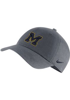 This Michigan Wolverines Grey Adjustable Hat features a front embroidered team logo. Nike H86 Relaxed-Fit Adjustable Hat, High-density embroidery for front logo and Swoosh, Adjustable strap back closure, Washed fabric gives hat a soft, distressed look, Adjustable Closure, Cotton material, Cotton, Wipe clean with cloth or cleaning kit, 4 Collegiate Adjustable Dad Hat With Curved Visor, Adjustable Sports Hats With Embroidered Logo, Collegiate Sports Hat With Curved Brim, Collegiate Cotton Hats For Outdoor, Adjustable Collegiate Dad Hat For Sports, Collegiate Sports Dad Hat, Gray Curved Brim Baseball Cap For Sports Events, Collegiate Sports Cap, Team-colored Adjustable Hat With Curved Brim