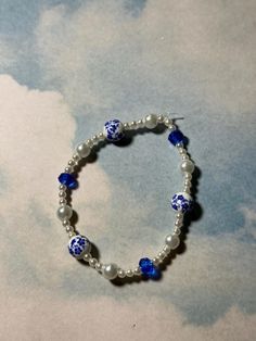 this is a 100% handmade bracelet! it has vintage-style white ceramic beads with printed blue flowers, pearls. and blue swarovski crystals! it is around 6  inches long, and will most likely fit a small to medium wrist! Ceramic Flower, Flower Beads, Flower Bracelet, Bead Jewelry, Handmade Bracelet, Ceramic Flowers, Ceramic Beads, Beaded Flowers, Bracelet Designs