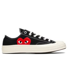 THIS PRODUCT IS IN MEN'S SIZING. CHUCK TAYLORS RUN ABOUT 1/2 SIZE LARGE, WE RECOMMEND SIZING DOWN. THIS PRODUCT DOES NOT QUALIFY FOR ANY DISCOUNTS OR SPECIAL PROMOTIONS. The concept of the Comme des Garcons PLAY line is design by not designing. Characterized by the iconic red heart logo designed by artist Filip Pagowski, the line is a collection of unisex basics for those who enjoy simplicity. An extension of the PLAY collection is an ongoing collaboration with Converse. Pictured is the Converse Converse Shoes With Heart, Converse Garcons Outfit, Converse Heart Shoes, Cdg Shoes, Converse Cdg, Heart Converse, Filip Pagowski, Comme Des Garcons Shoes, Commes Des Garcons