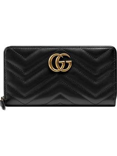 Gucci's wallet is part of the 'Marmont' family, one of the brand's iconic and best-loved collections. It's been crafted in Italy from quilted leather in a chevron pattern and topped with the iconic 'GG' motif. Can't beat a classic. Featuring a gold-tone logo plaque and a gold-tone top zip fastening. | Gucci Marmont quilted leather wallet Gucci Marmont, Gucci Gg Marmont, Wallets For Women Leather, Gucci Wallet, Gg Marmont, Handbag Wallet, Gucci Accessories, Carry All Bag, Wallet Accessories