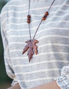 Experience the natural beauty of autumn with these handmade maple leaf necklaces with an adjustable knot. Made with careful attention to detail, each pendent showcases the beautiful gradient of fall colors, ranging from deep burgundy to warm orange. Perfect for nature enthusiasts and those who adore seasonal accessories, these unique necklaces are ideal for everyday wear or special occasions.  The unique design adds a touch of elegance and earthiness to any outfit, making them a perfect gift for Brown Leaf-shaped Jewelry For Gift, Handmade Jewelry For Fall Gift, Brown Jewelry For Fall Season Gift, Brown Jewelry For Fall Gifts, Brown Jewelry Gift For Fall, Handmade Jewelry For Fall, Handmade Adjustable Jewelry For Fall, Adjustable Handmade Jewelry For Fall, Leaf Necklaces